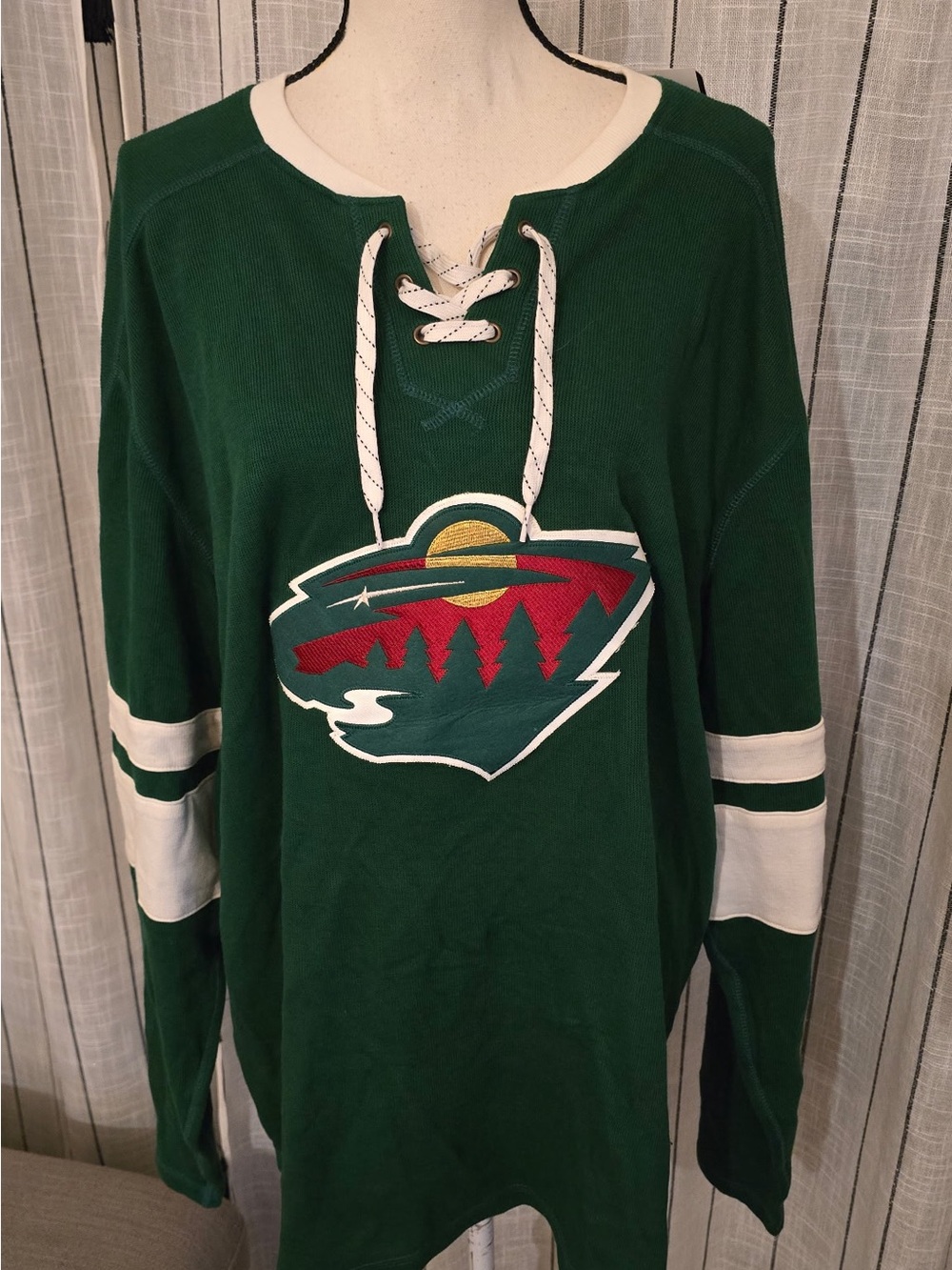 CCM Green V-Neck Lace-Up Sweater with White Trim and Multicolor Crest